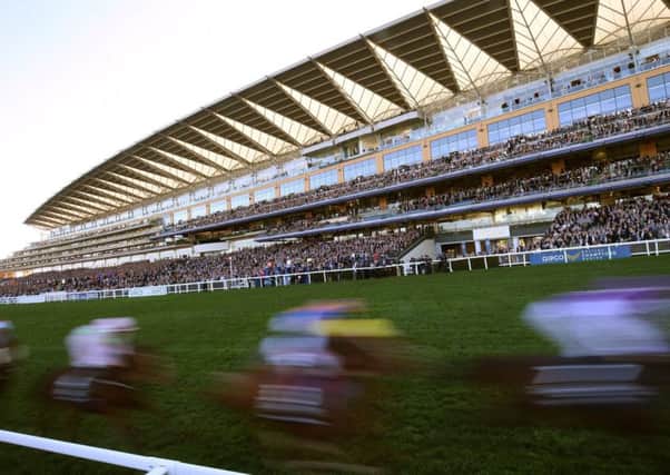 Runners passing the grandstand at Ascot. Picture: Julian Herbert/PA Wire.