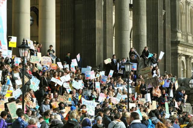 School students with their banners on the Town Hall steps in Leeds at the Youth Strike for Climate strike in March.