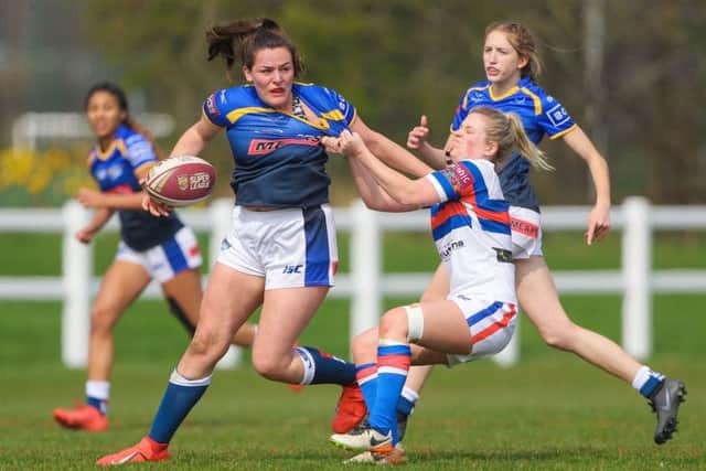 Leeds' Amy Johnson is tackled by Wakefield's Caitlin Clifton.