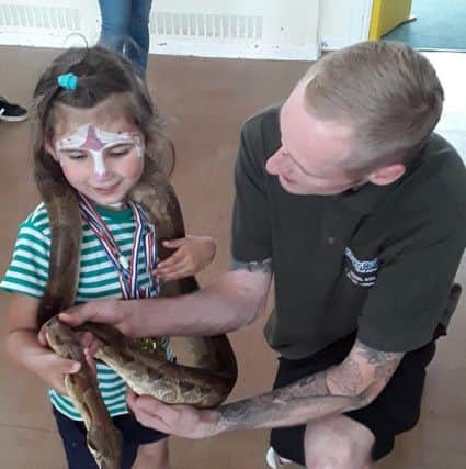 SNAKE: Ranger Robs Animals Experience with its snakes and tortoises  was a big hit at the birthday party