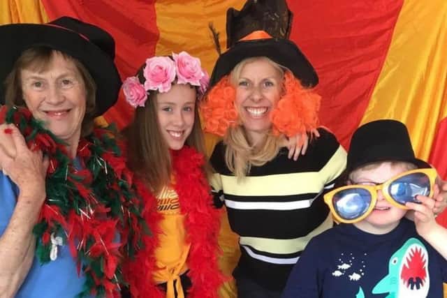SMILE: A family in fancy dress at Leeds Weekend Care Associations 20th birthday party at the Vine Education Centre last Saturday.
