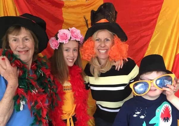 SMILE: A family in fancy dress at Leeds Weekend Care Associations 20th birthday party at the Vine Education Centre last Saturday.