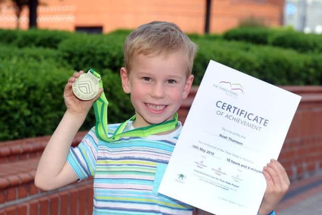 Noah Thomson, six, of Horsforth, after climbing the Yorkshire Three Peaks in record time