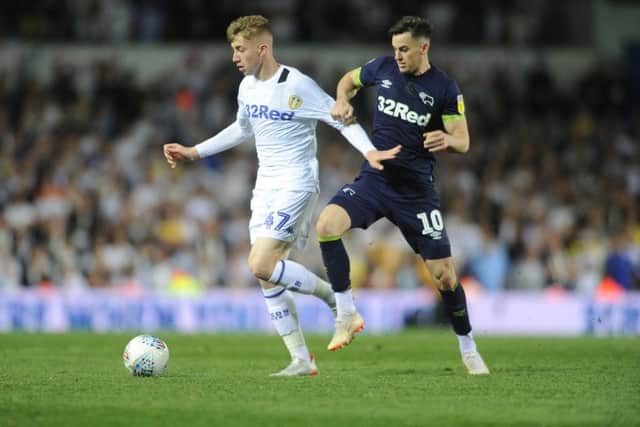 Leeds United's Jack Clarke tussles with Derby's Tom Lawrence.