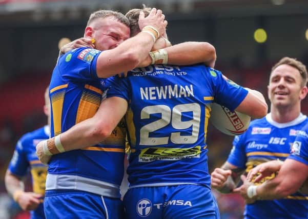 Brad Singleton, left, embraced Harry Newman during the clash with London Broncos at Magic Weekend.