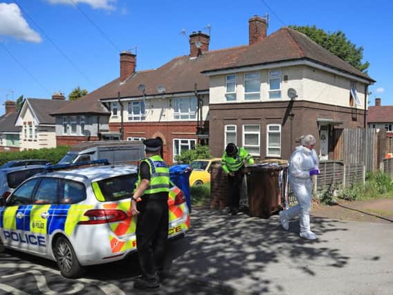 Police at the scene of the murders in the Shiregreen area of Sheffield