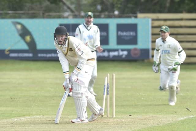 Archie Scott, of Pudsey St Lawrence, is bowled by New Farnley's Max Law. PIC: Steve Riding