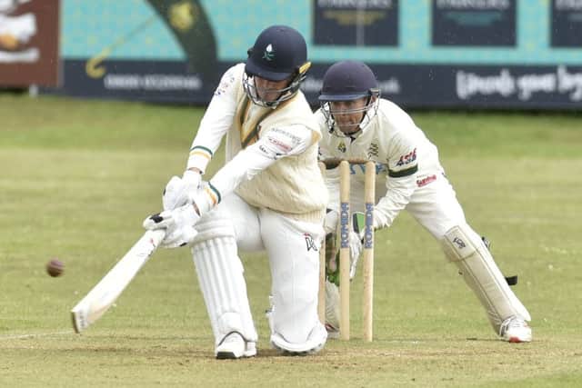 Pudsey St Lawrence's Jordan Thompson takes no chances against visitors New Farnley. PIC: Steve Riding
