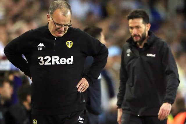 Leeds United manager Marcelo Bielsa (L) and coach Carlos Corberan (R).