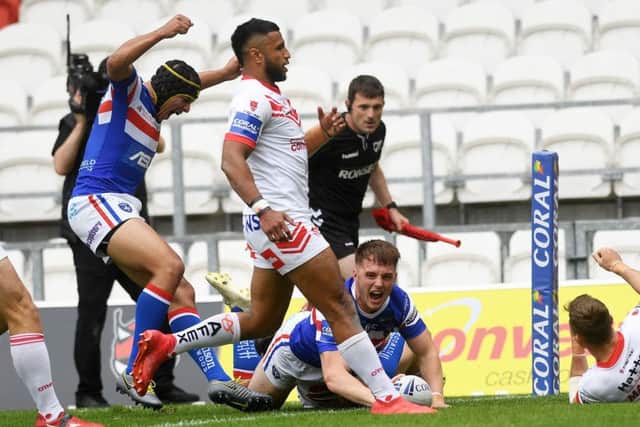 Wakefield's Jack Croft scores against St Helens.