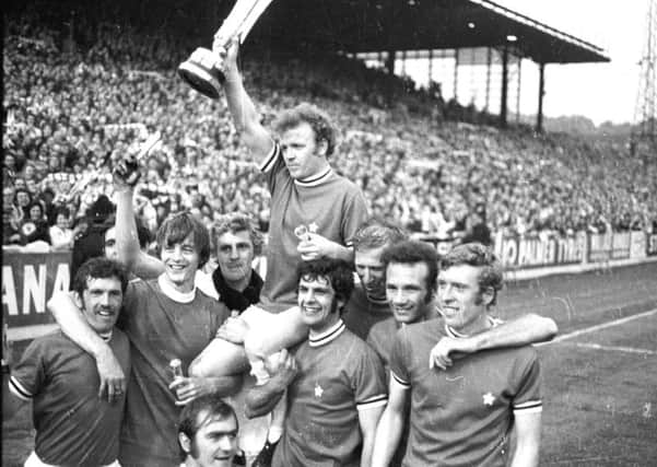 Billy Bremner lifts the Inter-City Fairs Cup in 1971 following Leeds United's victory over Juventus on away goals in the final.