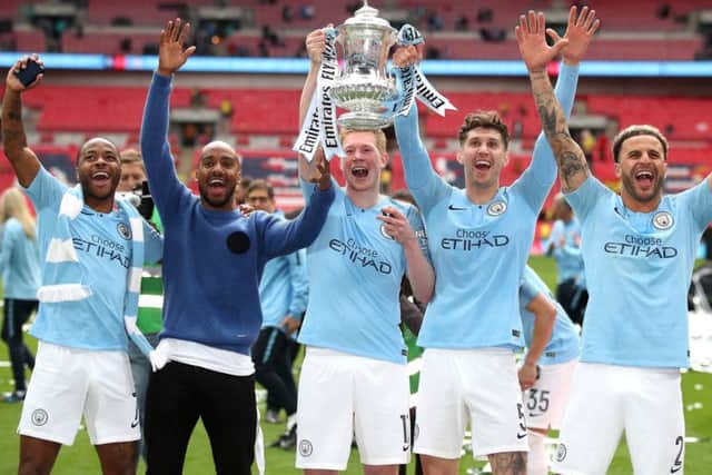 FA Cup winner: Manchester City's John Stones, fourth left, wants success on international stage.