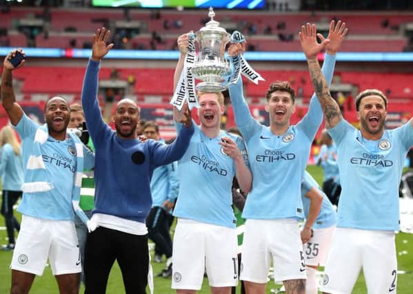 FA Cup winner: Manchester City's John Stones, fourth left, wants success on international stage.