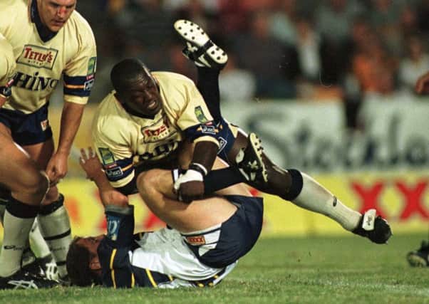 Anthony Farrell upends North Queensland Cowboys' Steve Walters in 1997.