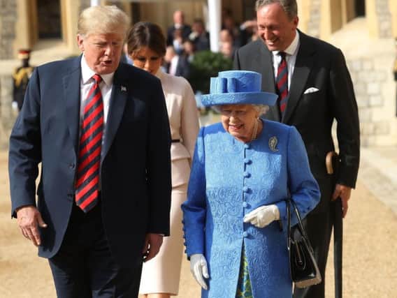 Queen Elizabeth II, US President Donald Trump and his wife Melania walk from the Quadrangle after inspecting an honour guard at Windsor Castle in 2018. Photo: Chris Jackson/PA Wire