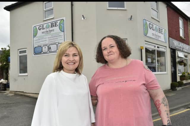 Louisa Street and Miranda Lyons outside the GLOBE shop at Kippax.