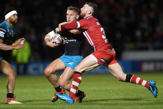 Jackson Hastings tackles Leeds Rhinos' Brad Dwyer.
Picture Jonathan Gawthorpe