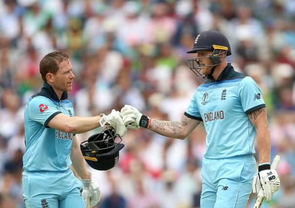 England's Eoin Morgan (left) and Ben Stokes during the ICC Cricket World Cup group stage match at The Oval. Picture: Nigel French/PA