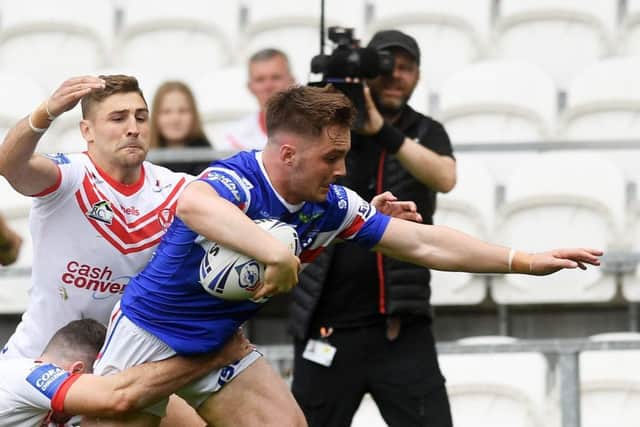 Wakefield's Jack Croft goes over to score on his first team debut at St Helens.