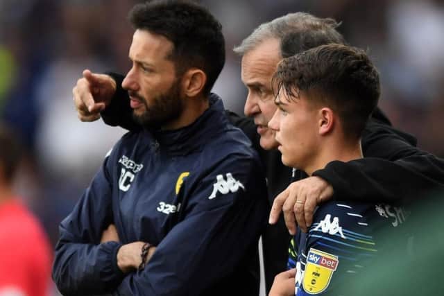 Ready for action: From left, Carlos Corberan and Marcelo Bielsa with Jamie Shackleton. Picture: Jonathan Gawthorpe