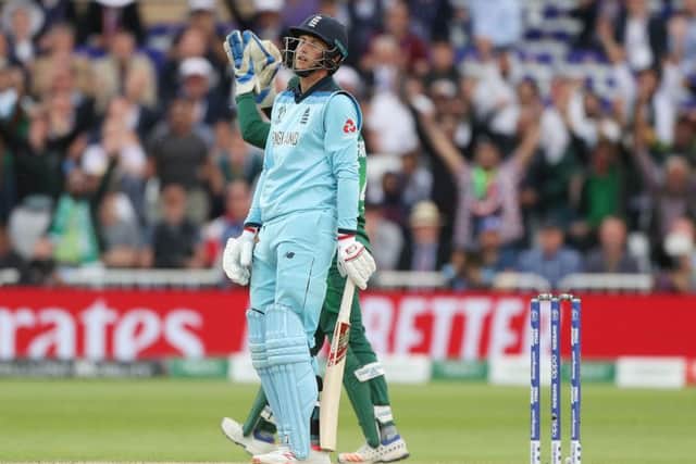 England's Joe Root is dismissed for 107 .