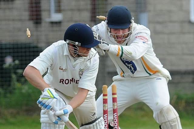 Pudsey St Lawrence wicketkeeper, Charlie Best, celebrates after stumping Tim Jackson of Woodlands for 22 off the bowling of Chris Marsden. But it was Woodlands who won by four wickets and now have a lead of 31 points at the top of the division. PIC: Steve Riding
