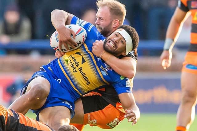 Kallum Watkins is tackled by Castleford's Paul McShane.