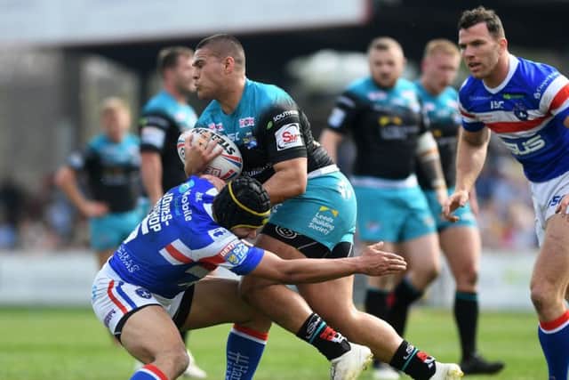 Wakefield's Ben Jones-Bishop tackles Leeds' Tui Lolohea during the match between the two sides at Belle Vue in April.