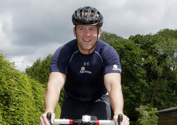 Mike Tindall departs on a charity bike ride to raise money for a Parkinson's charity this weekend.