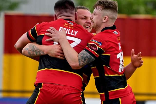 Dewsbury's Kyle Trout celebrates scoring against Swinton.