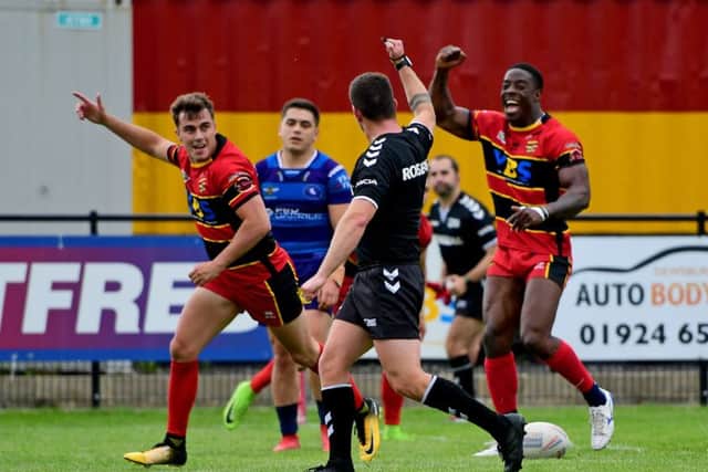 Dewsbury's Lewis Heckford celebrates scoring against Swinton.