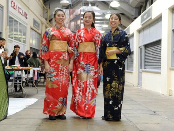 Leeds University students Helena da Costa, Louisa Luong and Mia Huffman dress in traditional Japanese kimono's at the third Sakura Japanese Cultural Festival, a special pop-up experience in Leeds Market on 8 June 2019.