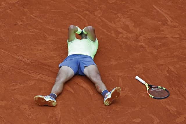 Spain's Rafael Nadal celebrates his record 12th French Open title after winning the men's final match against Austria's Dominic Thiem in four sets. Picture: AP/Pavel Golovkin)