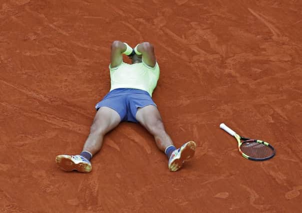 Spain's Rafael Nadal celebrates his record 12th French Open title after winning the men's final match against Austria's Dominic Thiem in four sets. Picture: AP/Pavel Golovkin)