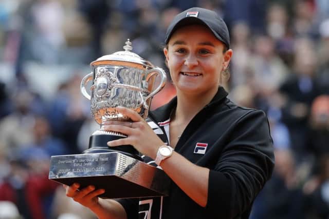 Australia's Ashleigh Barty holds the trophy as she celebrates winning the French Open women's singles final against Marketa Vondrousova. Picture: AP/Christophe Ena.