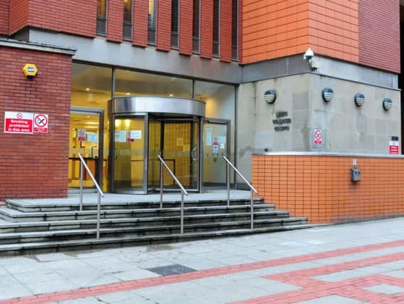 Three men are appearing at Leeds Crown Court today