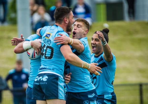 Featherstone Rovers' players celebrate during their win over Sheffield Eagles. 
Picture: James Heaton.