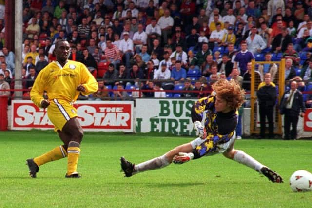 Jimmy Floyd Hasselbaink scores Leeds United's winner past ex-Leeds junior goalkeeper Nicky Byrne in their 2-1 victory over Shelbourne