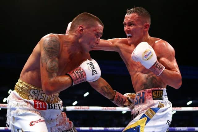 WORLD BEATER: Josh Warrington on his way to victory against Lee Selby at Elland Road last year. Picture: PA.