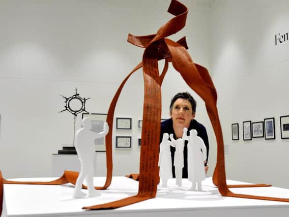 Pippa Hale with a model of her sculpture design, Ribbons. Picture by Gary Longbottom.