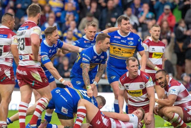 Adam Cuthbertson gathers himself up from the ground after scoring Leeds Rhinos' first try against Wigan. Picture: Bruce Rollinson