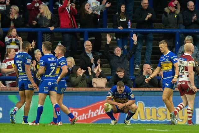 Leeds Rhinos' players show their disappointment at full-time against Wiga on Friday night.
 Picture: Bruce Rollinson