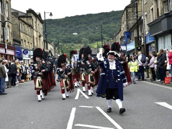 Otley bellman Terry Ford leads the parade.