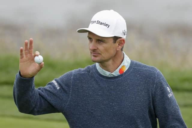 Lasting the pace: Justin Rose waves after his putt on the eighth.