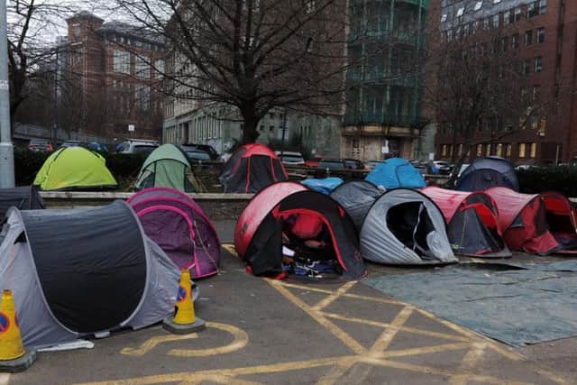 Tents close to the spot the woman's body was found. Most were removed in February, but a handful remain in the area.