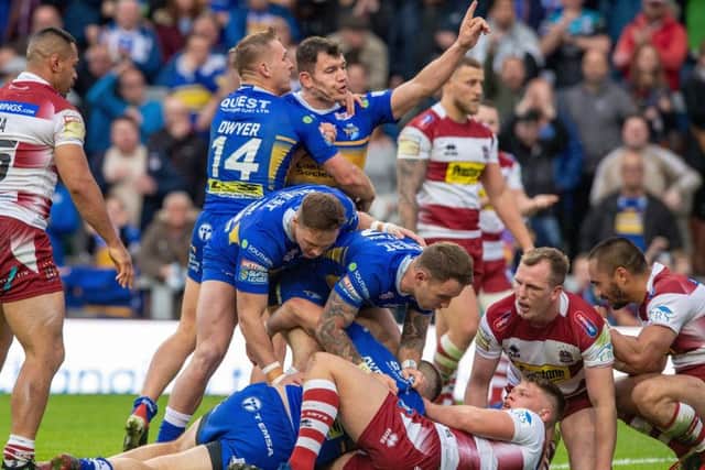 Adam Cuthbertson score the Rhinos first try against Wigan (Picture: Bruce Rollinson)