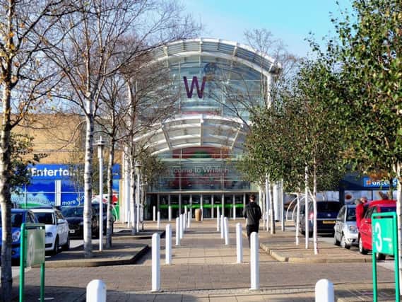 A man has been arrested after a police chase through the White Rose Centre in Leeds.