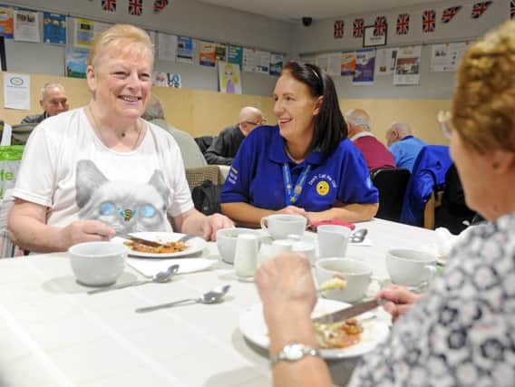 Dawn Newsome, chief executive of Armley Helping Hands, at the supper club, with Maureen Wheelan, pictured left.