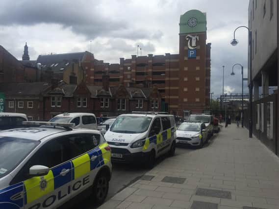 Police outside the Trinity Centre car park after a man fell to his death
