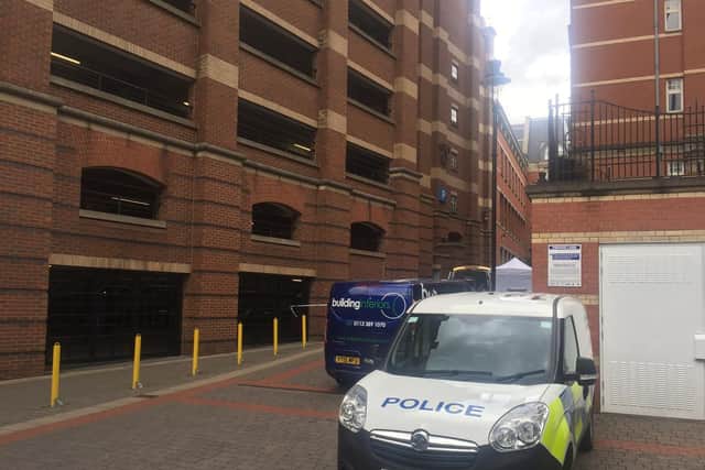 Police outside the Trinity Centre car park after a man fell to his death